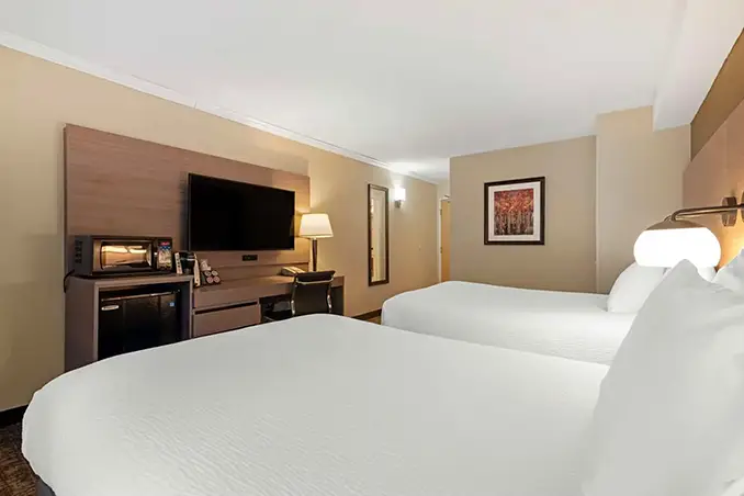 Double queen guest room at Windjammer Inn & Conference Center in South Burlington, VT