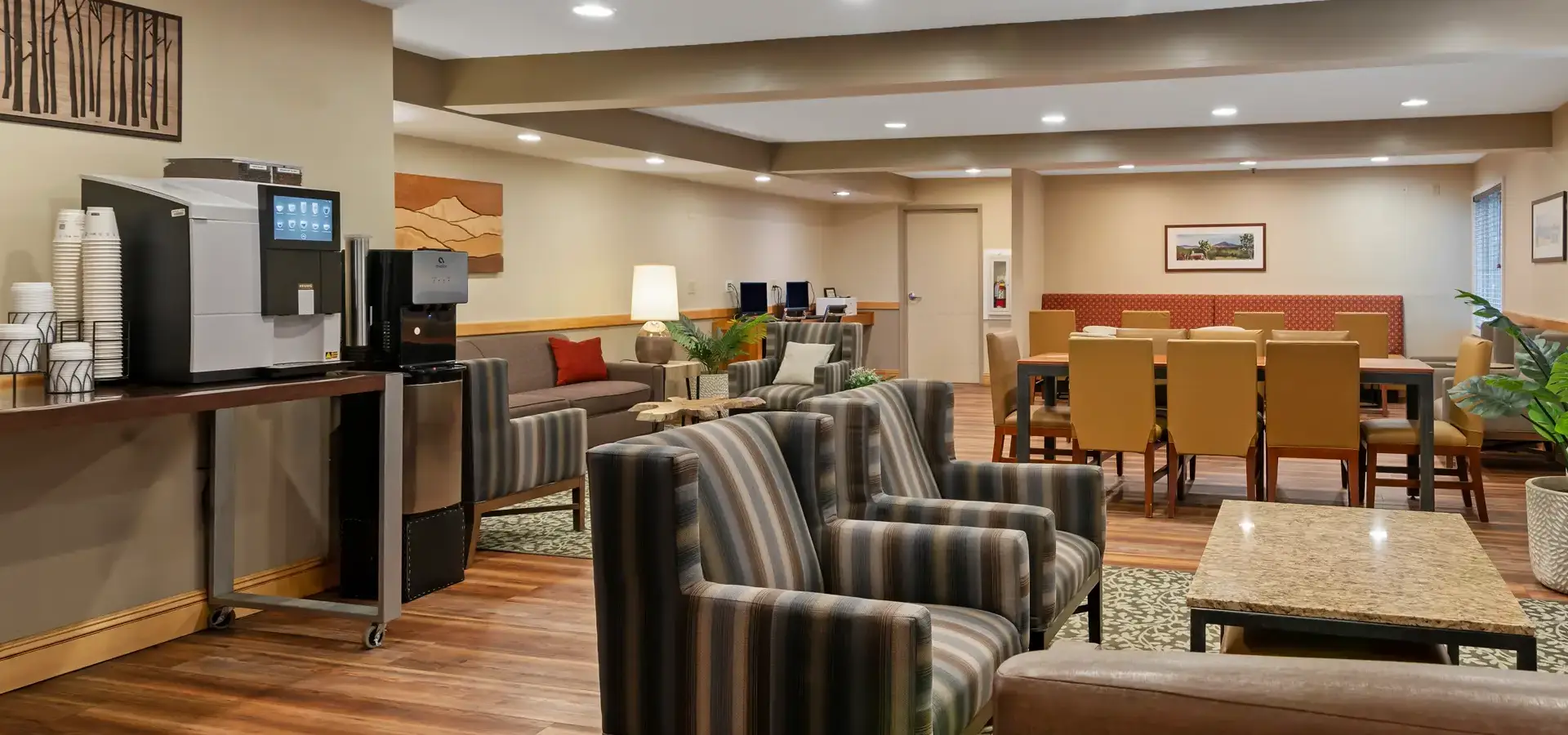 Hotel lounge and coffee station at Windjammer Inn & Conference Center in South Burlington, Vermont.
