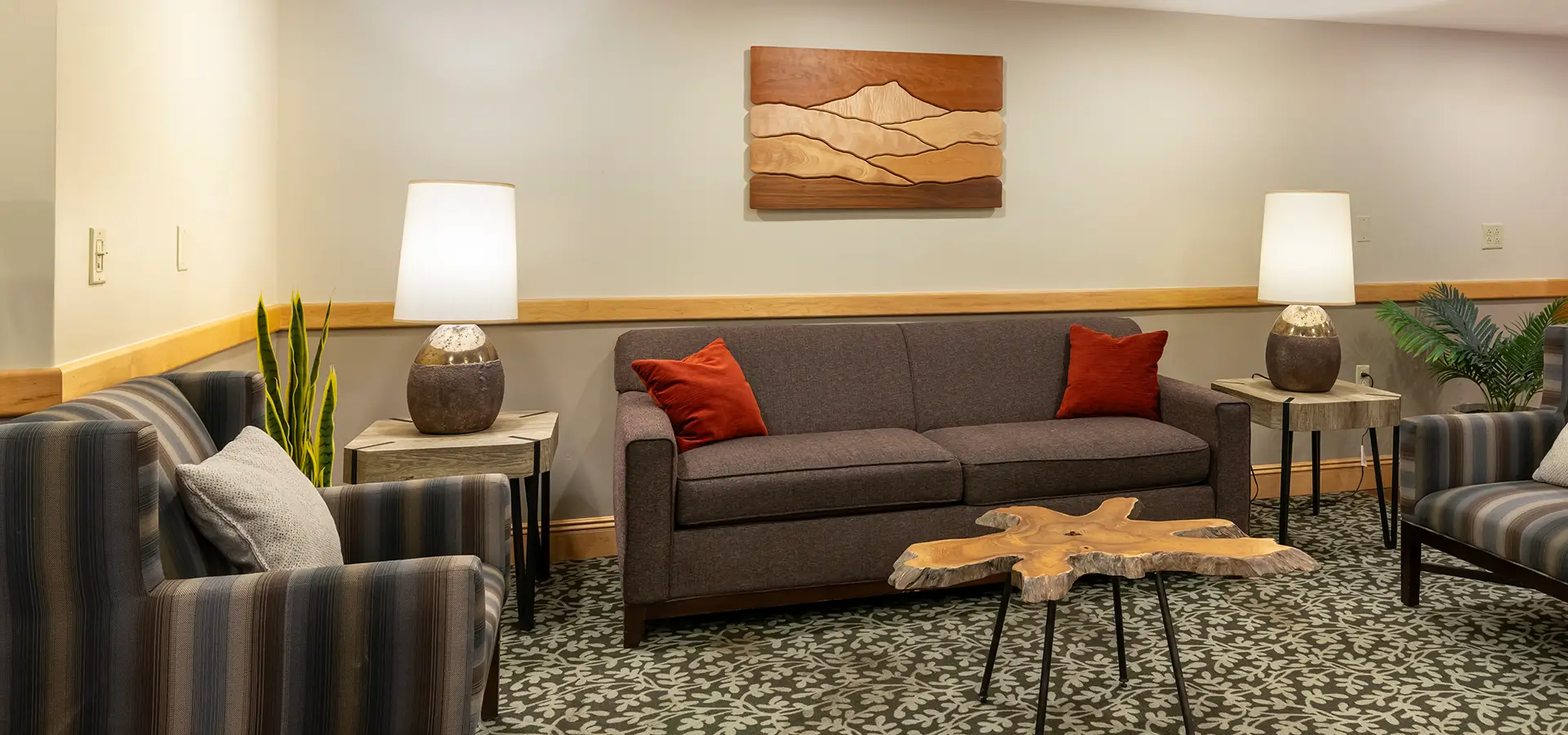 Modern guest room with king bed and warm lighting at Best Western Plus Windjammer Inn & Conference Center